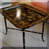 F14. Black and gold regency tray table. 20”h x 30”w x 22”d 